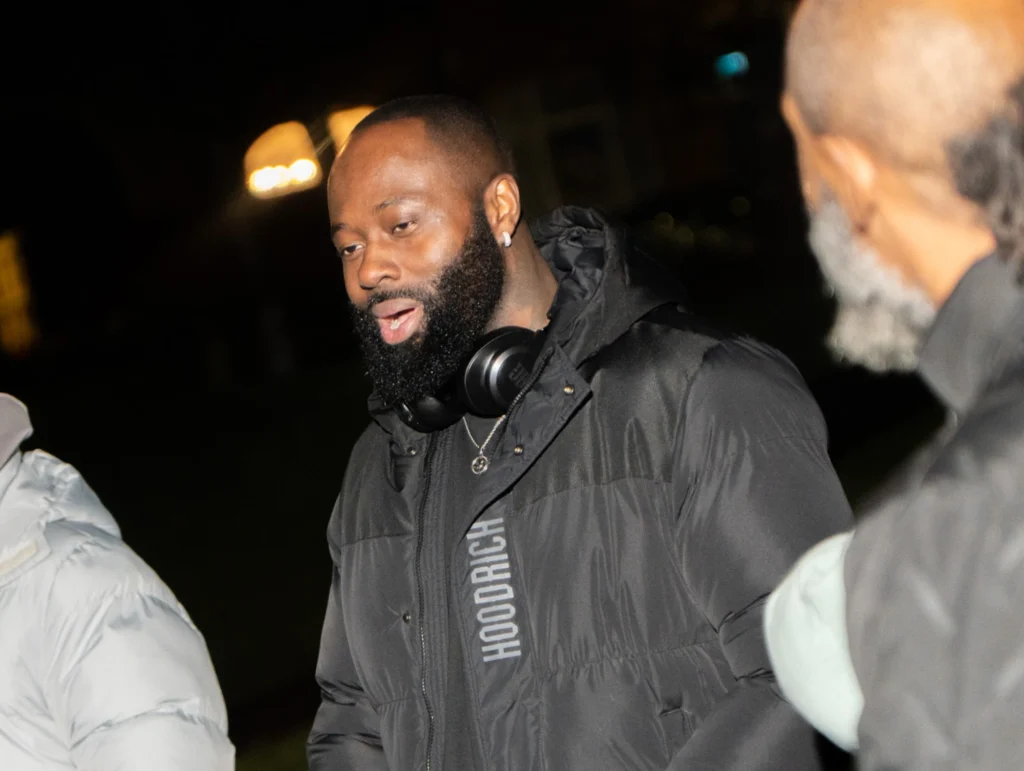 A-man-in-a-black-Hoodrich-jacket-with-headphones-around-his-neck-speaks-during-an-MPC-event-part-of-Season-2-Session-3-Relationships