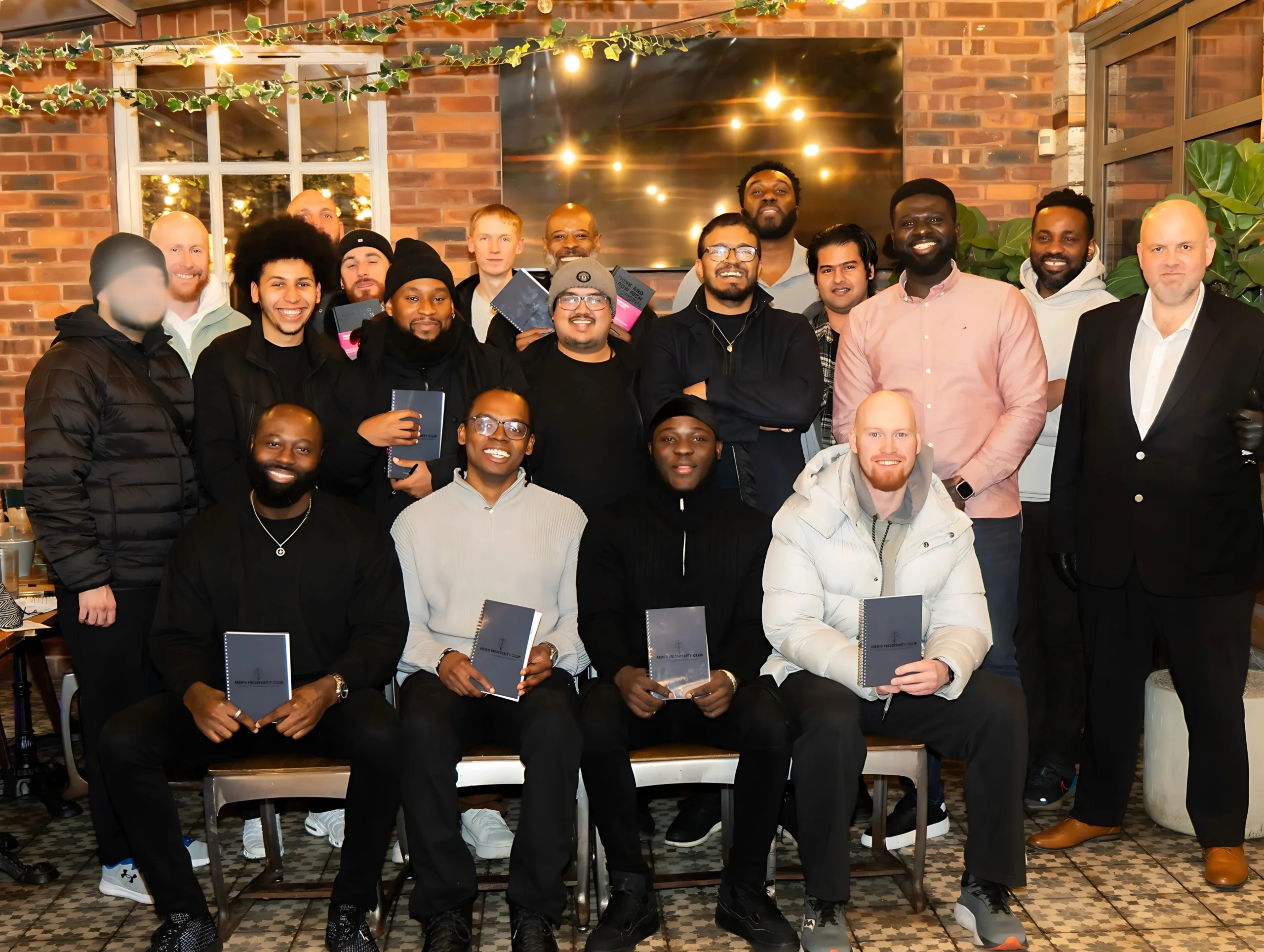 MPC-relationship-event-group-photo-with-participants-holding-notebooks