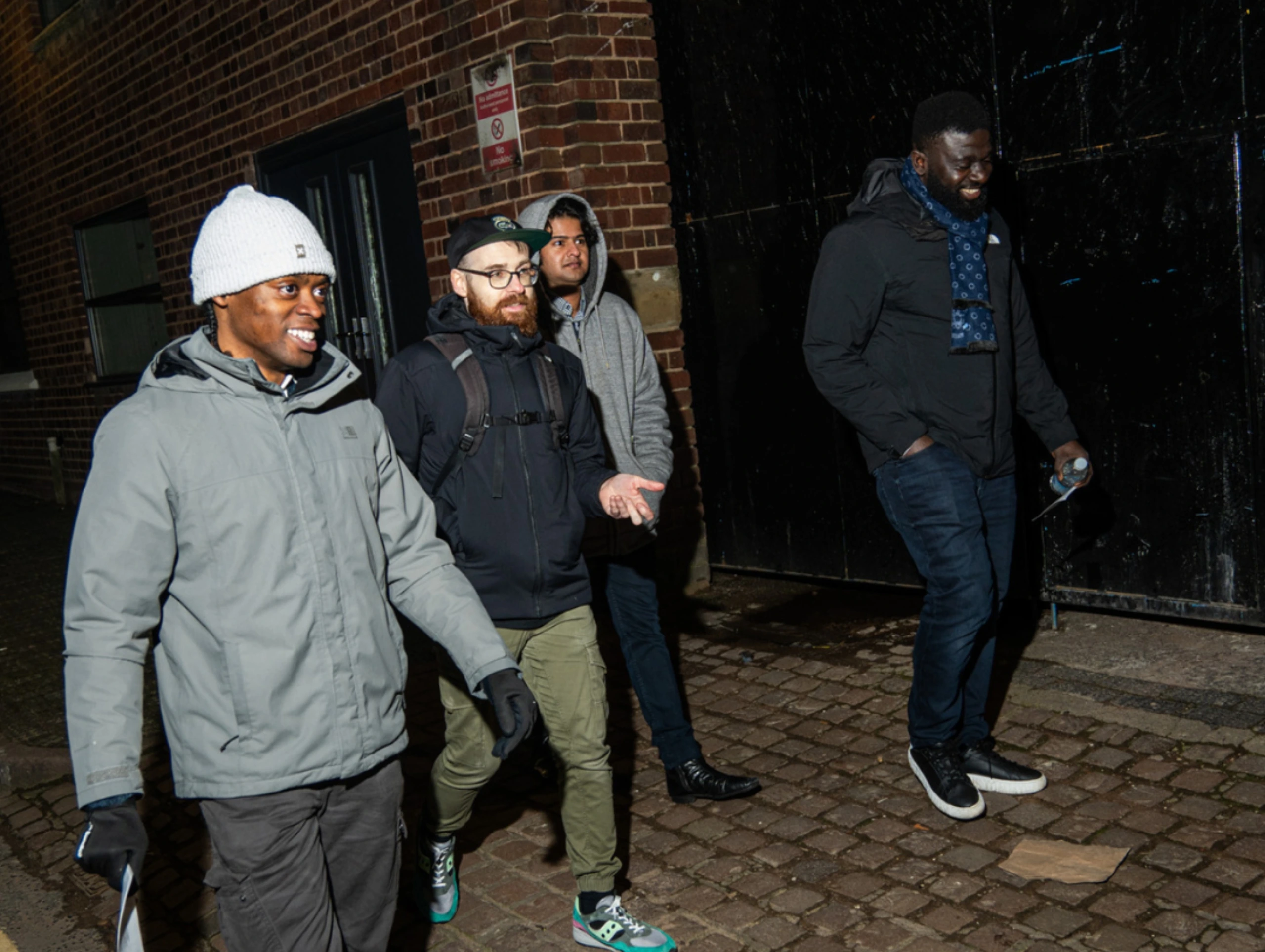 A-group-of-four-people-walking-outdoors-during-season-2-session-4-of-MPC