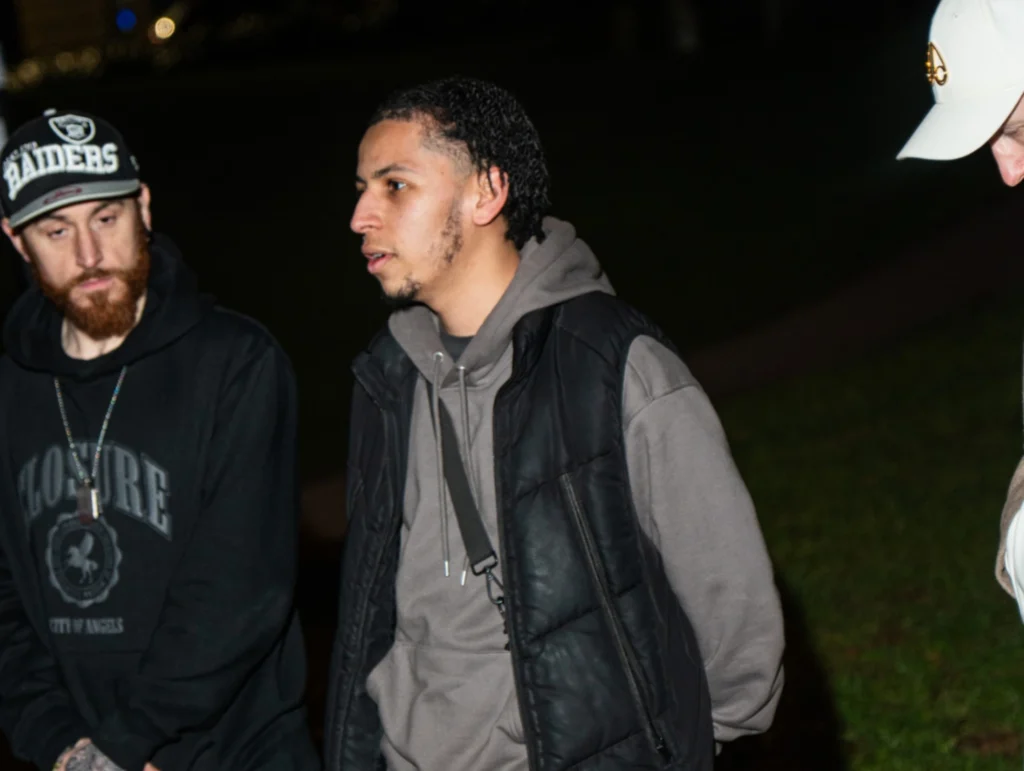 Two-men-having-a-conversation-outdoors-during-season-2-session-4-of-MPC