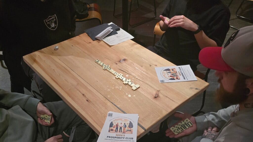 MPC-group-gathered-around-a-table-during-an-event-focused-on-health-fitness-and-brain-exercises