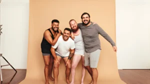 Four-diverse-men-laughing-together-embracing-self-acceptance-and-body-positivity