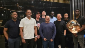 Group-of-men-smiling-at-an-MPC-events-Social-Game-gathering-in-a-modern-venue-setting