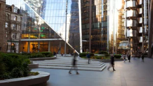 Modern-business-centre-in-London-with-people-walking-highlighting-Small-Business-Cash-Flow-environment