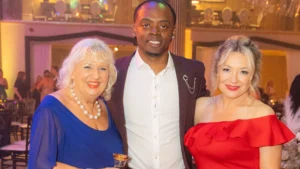 Ronaldo-Hare-at-the-2025-Ladies-First-Awards-posing-with-the-two-founders-of-Ladies-First-in-a-celebratory-ballroom-setting