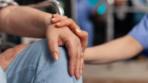 A-comforting-gesture-of-one-person-holding-anothers-hand-symbolizing-compassion-and-Faith-and-Mental-Health