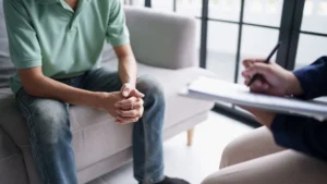 Man-talking-to-a-therapist-during-a-counselling-session-Depression-in-Men-support