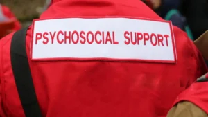 Psychosocial-support-on-the-back-of-a-red-uniform-emphasizing-mental-health-support-for-World-Mental-Health-Day-2025