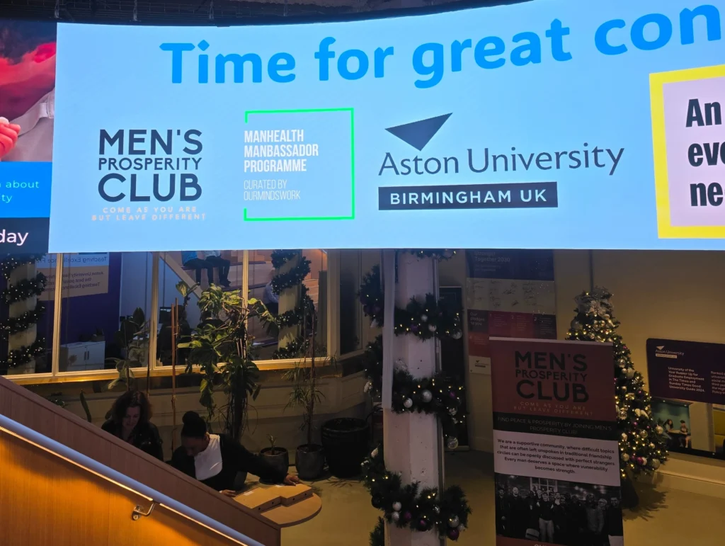 Attendees-smiling-at-Aston-Universitys-Mens-Day-event