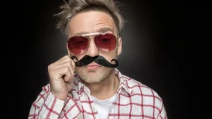 Man-with-a-fake-mustache-wearing-sunglasses-Movember