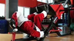 Santa-doing-leg-press-in-gym–Festive-Fitness