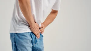 Man-holding-his-lower-abdomen-in-pain-How-to-Check-for-Prostate-Cancer-at-Home