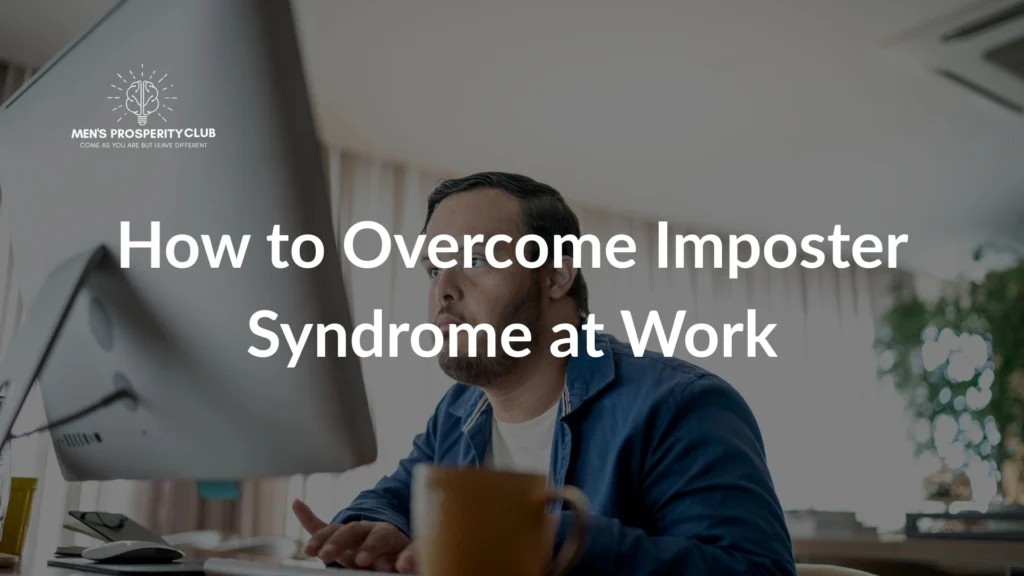 Man-working-at-desk-focusing-on-overcoming-imposter-syndrome