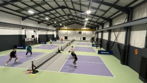 Pickleball-players-on-vibrant-indoor-courts-showing-a-fun-and-social-atmosphere-in-Birmingham