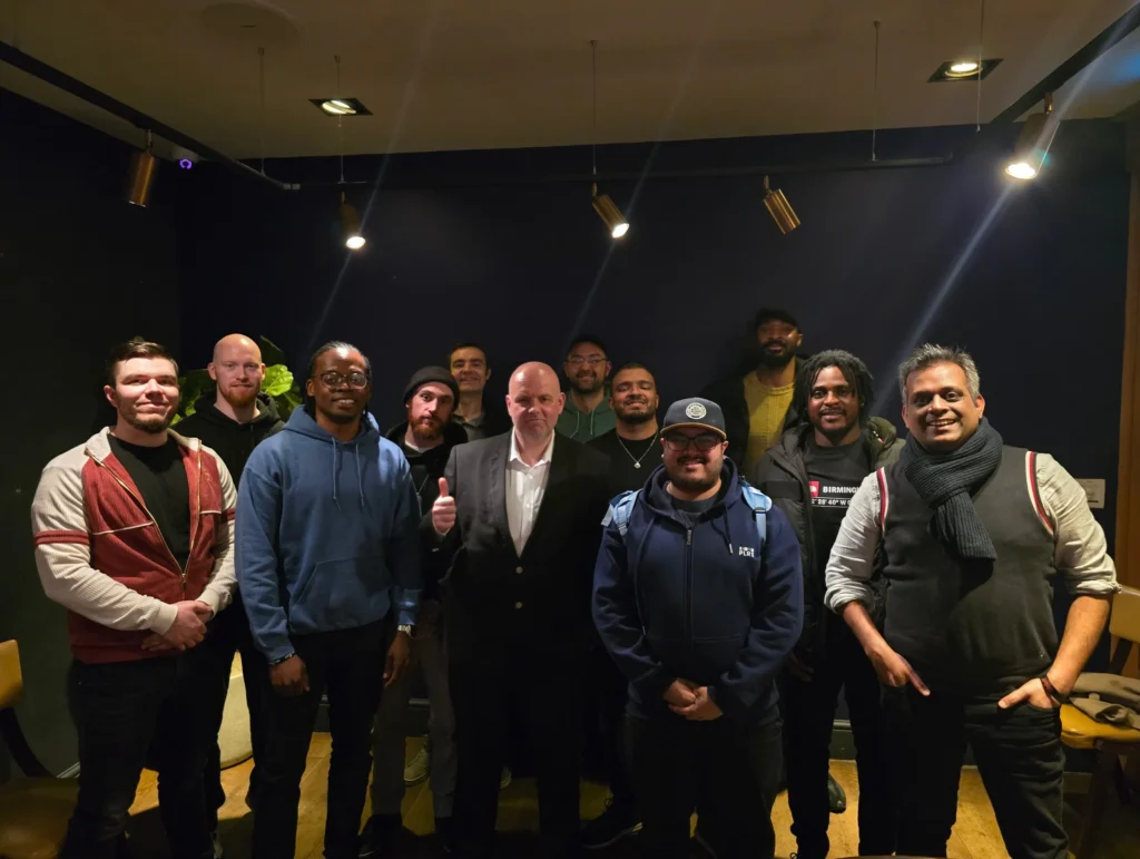 Team-standing-and-interacting-outside-with-conversation-centered-around-faith-and-spirituality-topics