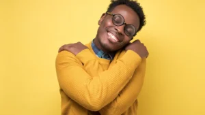 Man-hugging-himself-showing-Self-Compassion-and-self-care
