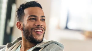 Smiling-man-reflecting-positive-mindset-and-Self-Compassion