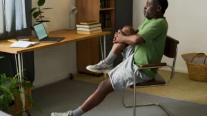 chair-exercise-seated-knee-stretch-indoors