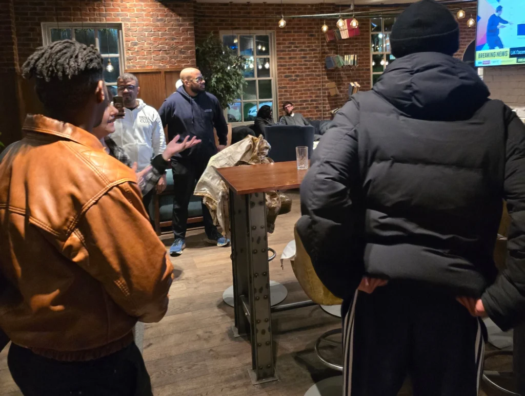 health-and-fitness-session-season-4-men-gathering-and-connecting-indoors