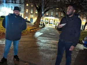 mental-health-session-season-4-men-standing-and-sharing-in-night-discussion