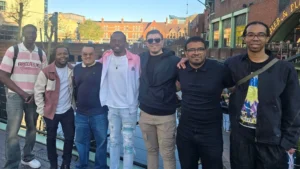 Men’s-Prosperity-Club-sustainable-community-members-standing-together-during-an-outdoor-community-activity